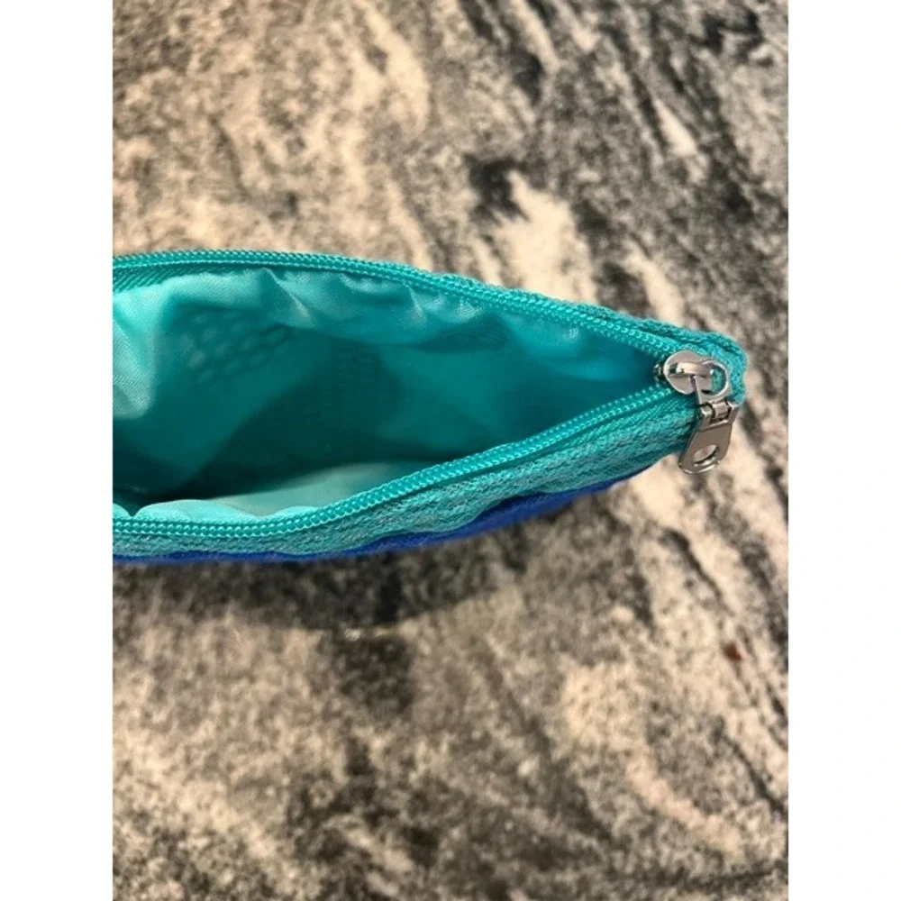 A New Day Green Zip Around Continental Wallet Wristlet‎ and a blue/teal pouch